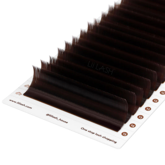 Closeup of Chocolate brown eyelash extension from a Dutch angle in lash tray