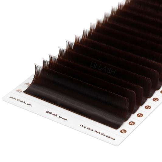 Closeup of Coffee brown eyelash extension from a Dutch angle in lash tray