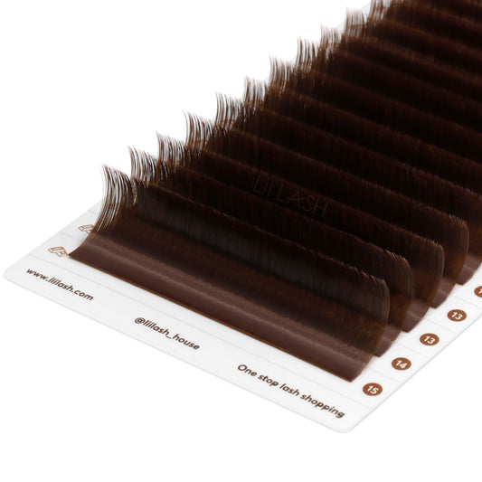 Closeup of Deep brown eyelash extension from a Dutch angle in lash tray