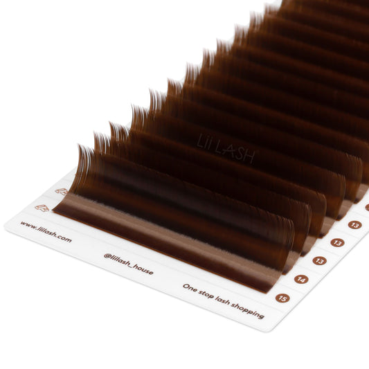 Closeup of Natural brown eyelash extension from a Dutch angle in lash tray